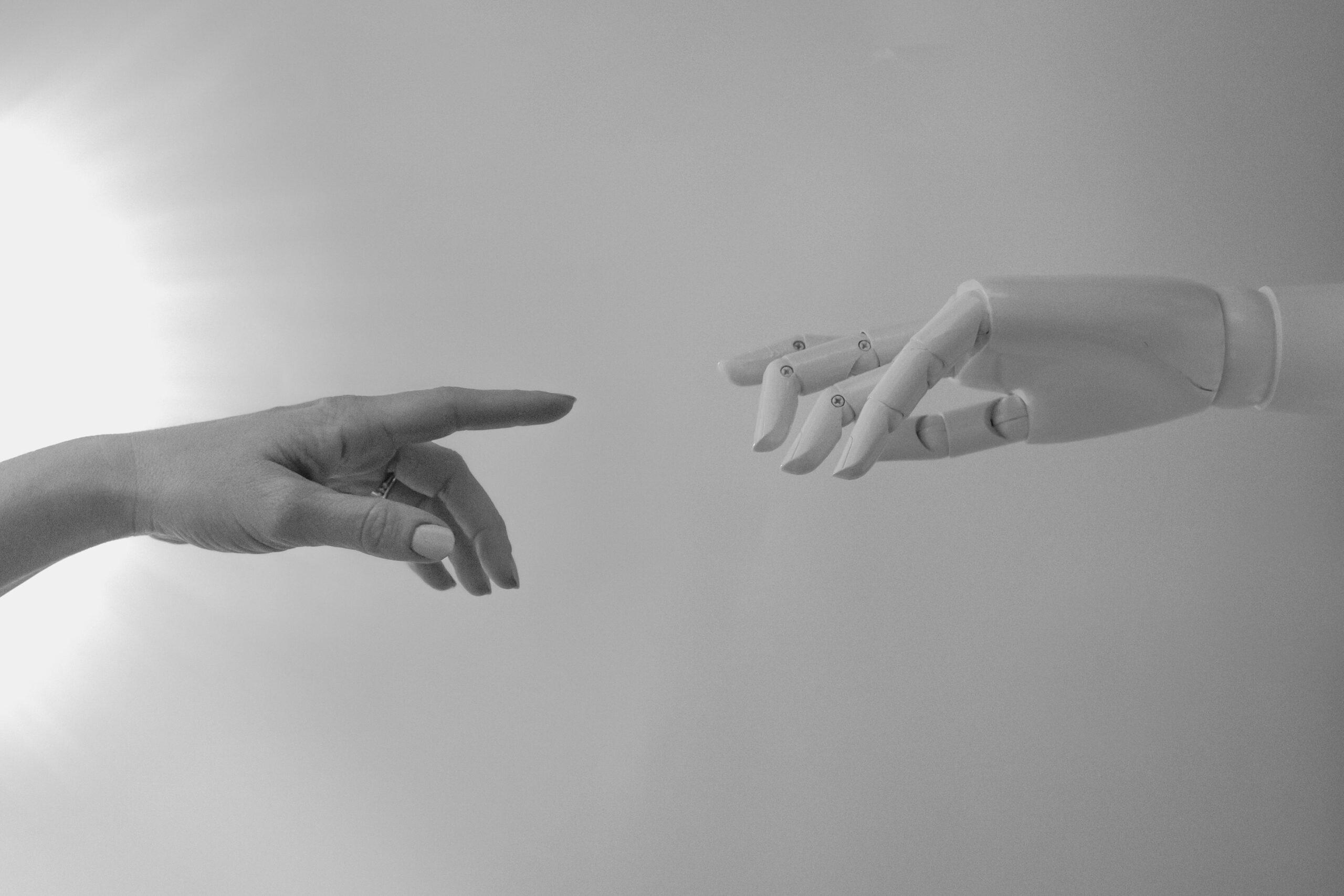 Photo by Tara Winstead: https://www.pexels.com/photo/black-and-white-photo-of-human-hand-and-robot-hand-8386422/
